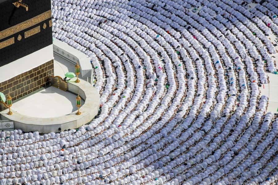 Night view of the Holy Kaaba surrounded by thousands of pilgrims performing Tawaf in Masjid al-Haram, Makkah
